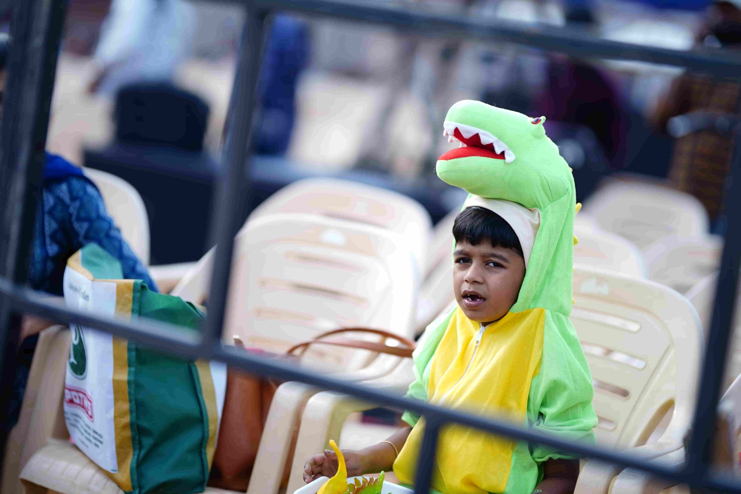 A pint-sized dino enthusiast steals the spotlight at the fest.