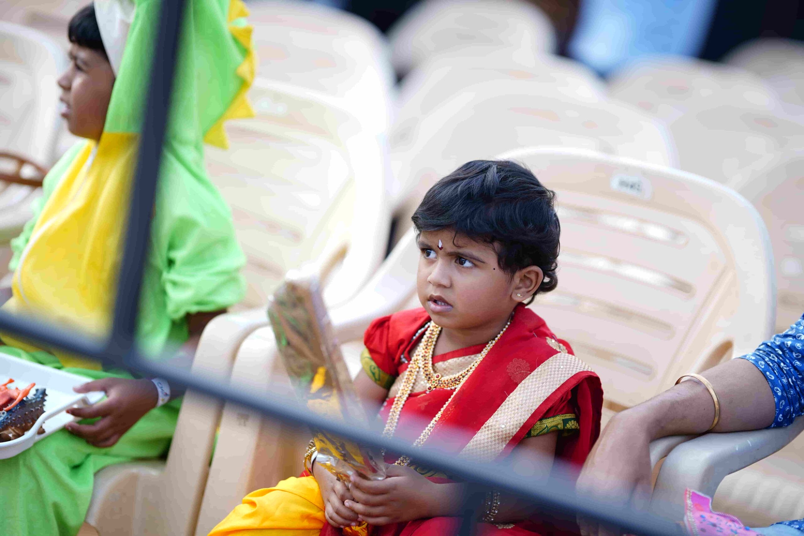A little girl dressed in a saree for a fancy dress competition.