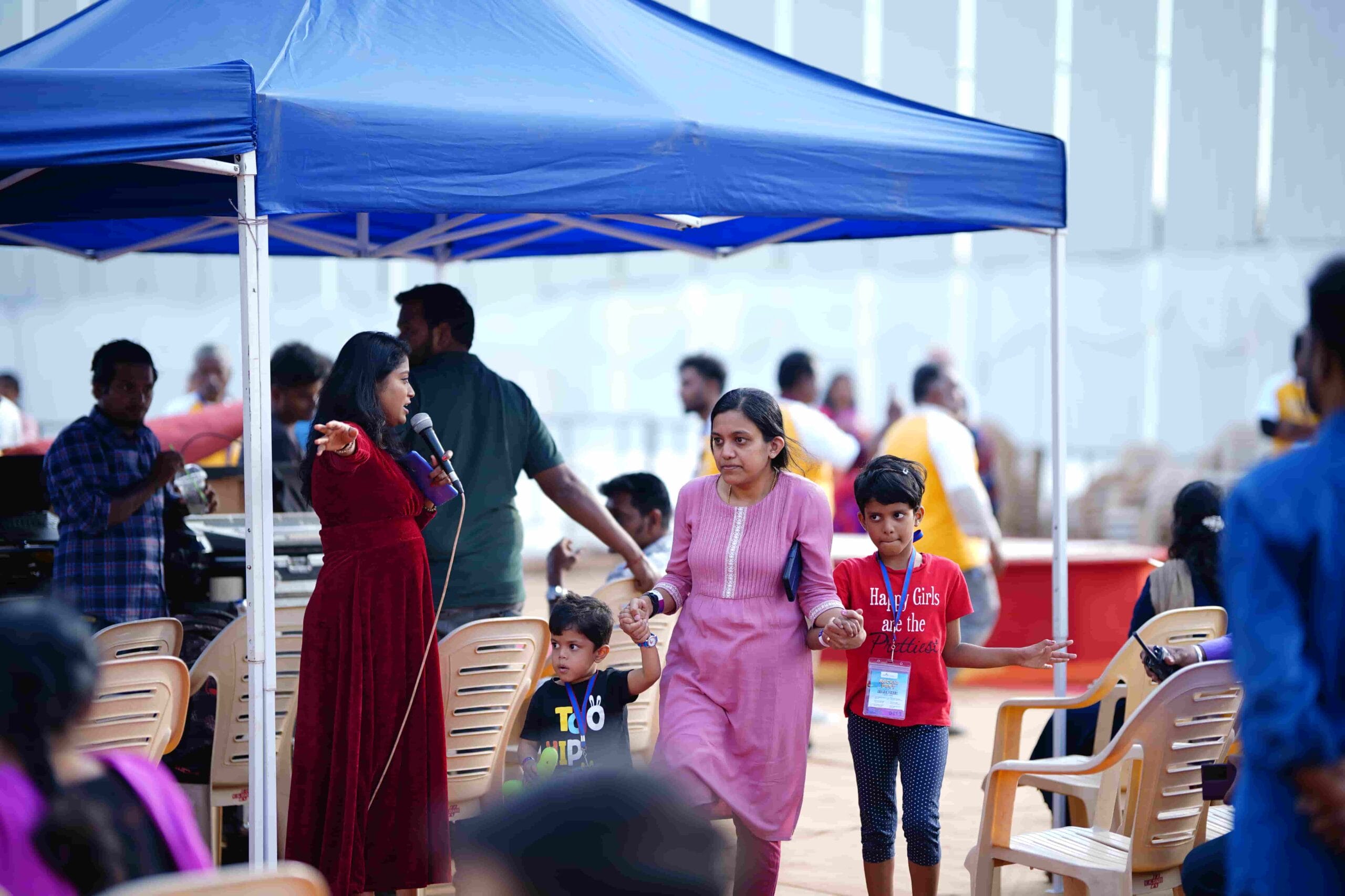 Anchor guiding the parents and kids at the fest at CMIS.