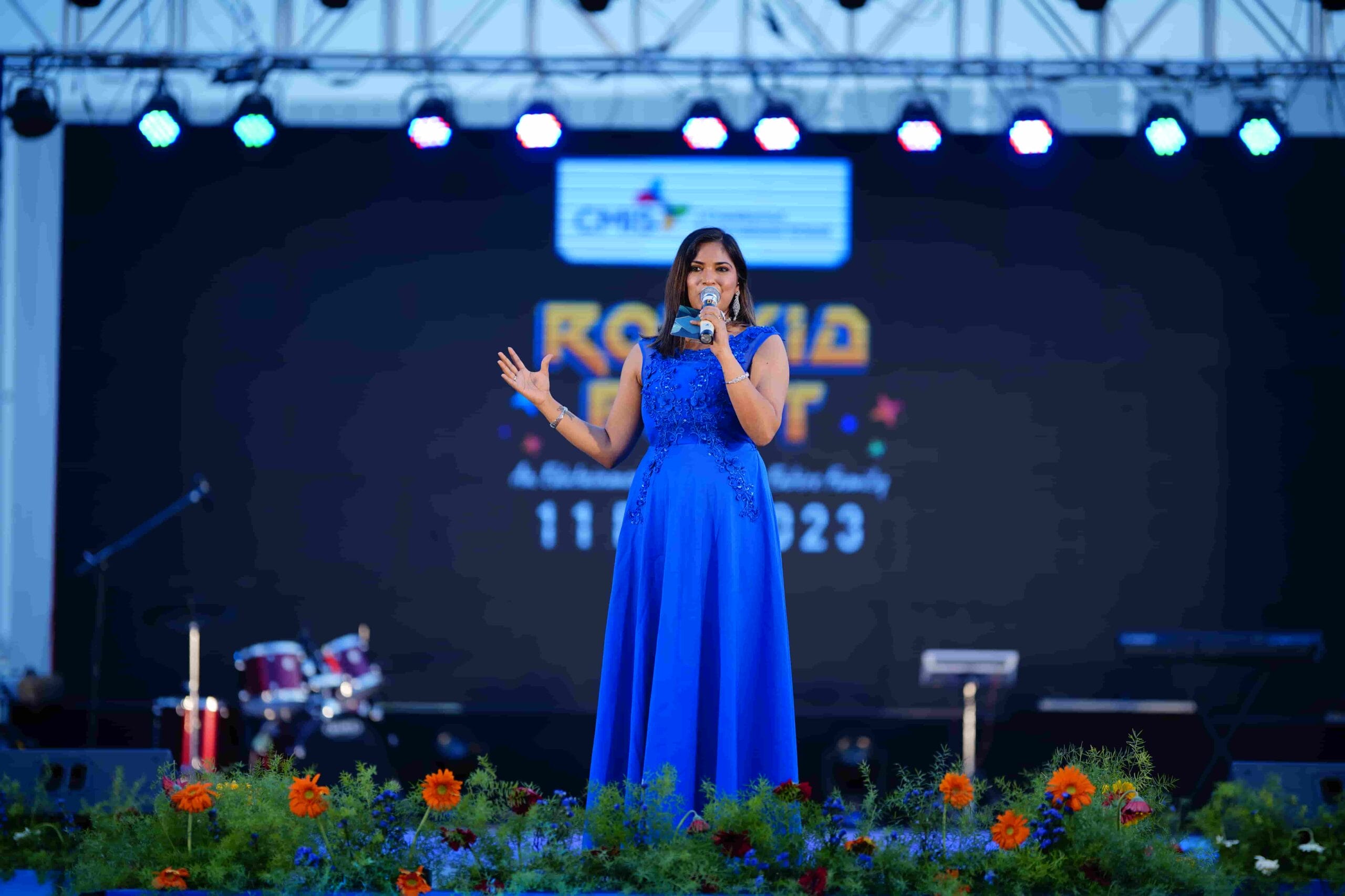 A woman anchor on stage.