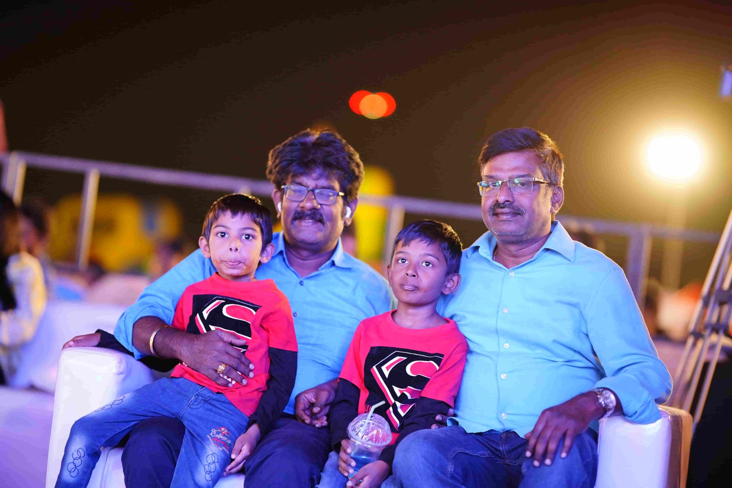 Students watch the stage performance with their parents.