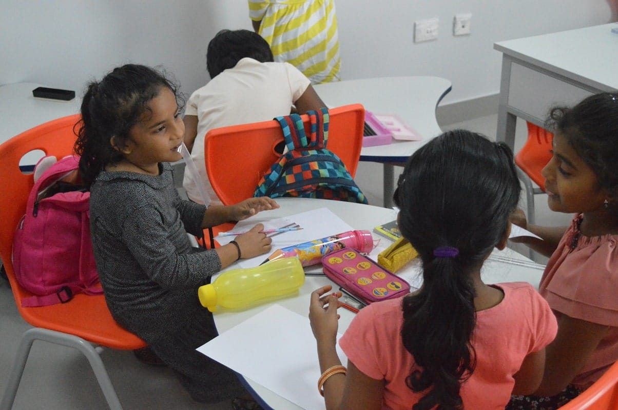 Happy children interacting with each other at Chandramari International School.