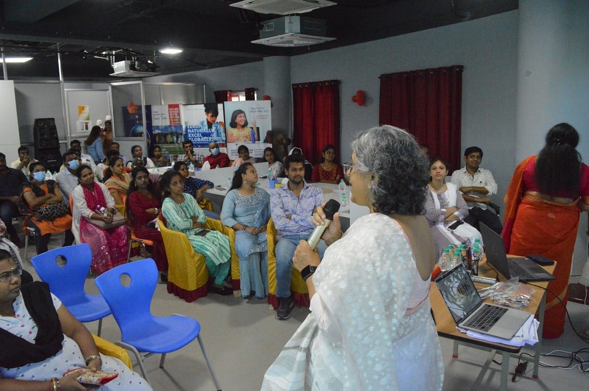A chief guest addressing a gathering at a conference hall in CMIS.