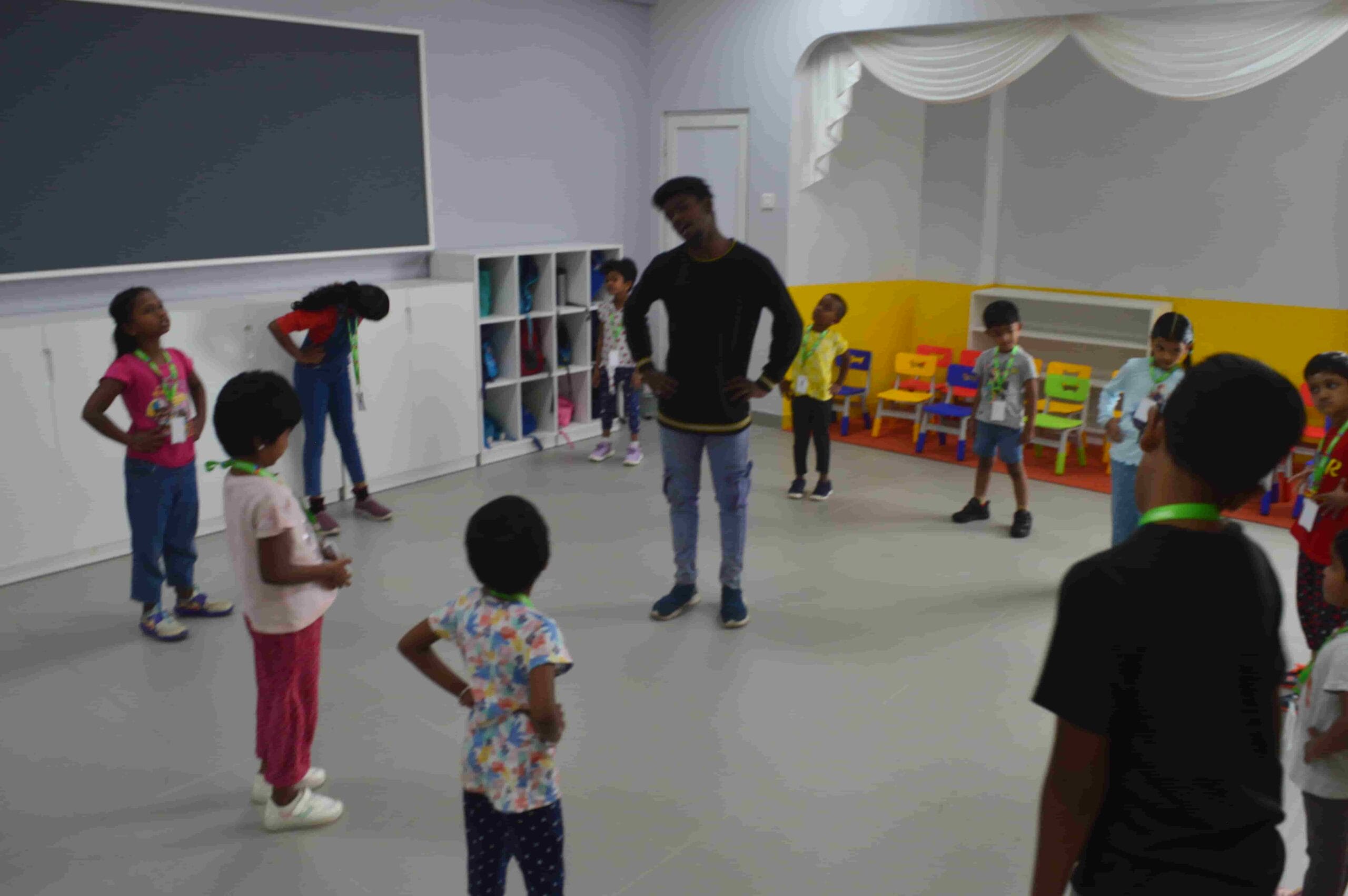 Kids doing warm up exercise inside the class.