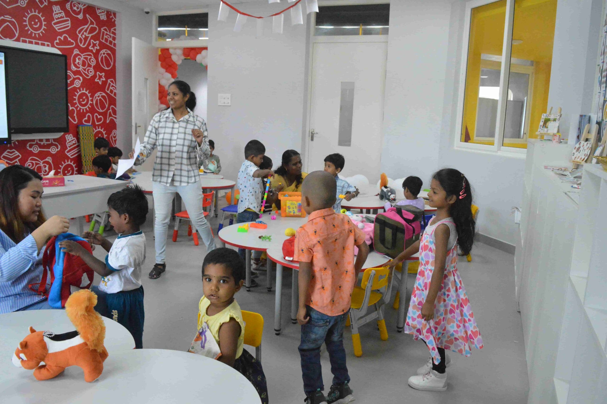 Students and teachers interact with each other in a classroom at CMIS.