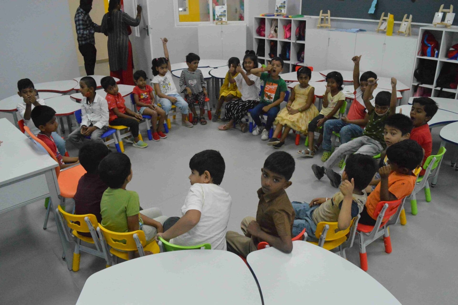 Children interacting and engaging in a group discussion together.