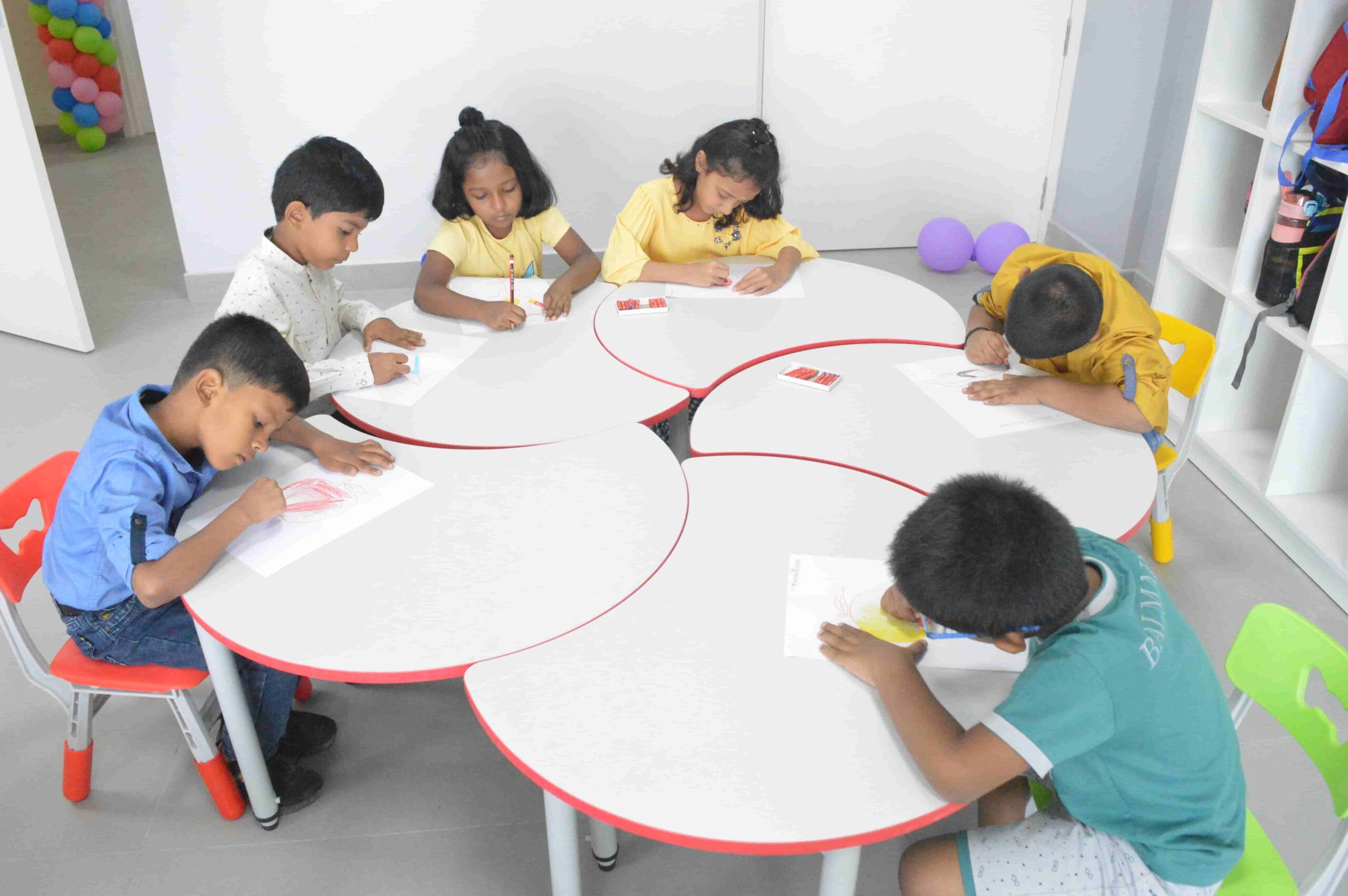Students drawing pictures of their favorite fruits.