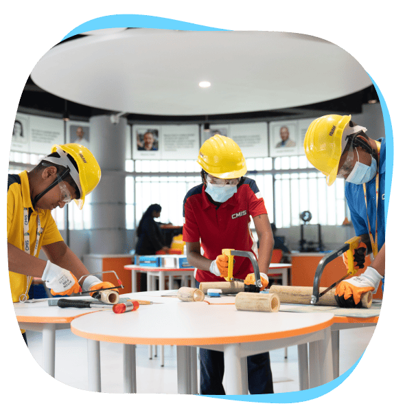 Students working in the innovation hub of CMIS.
