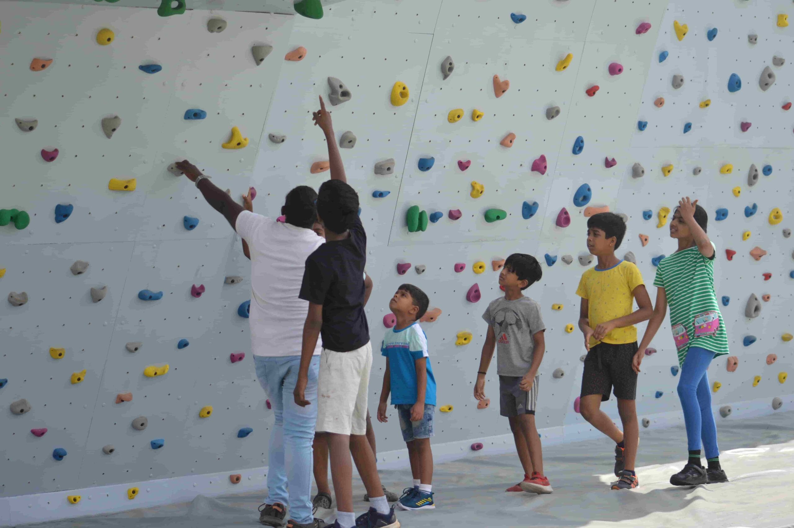Students waiting for their chance to climb the wall.