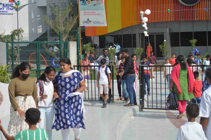 Parents and school children at the gate of Chandramari International School.