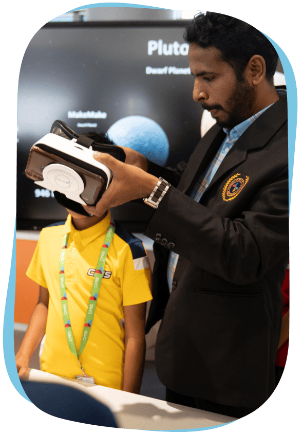 A teacher and student at CMIS's Digilab.