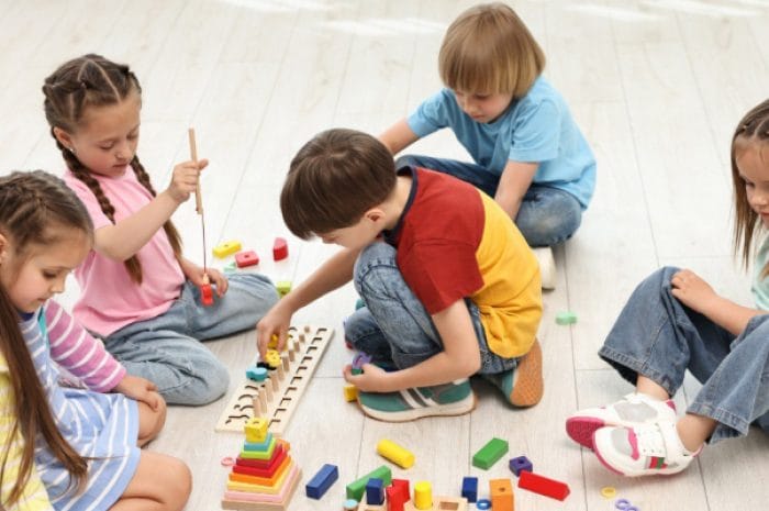 Children joyfully play and learn together, fostering creativity and collaboration.