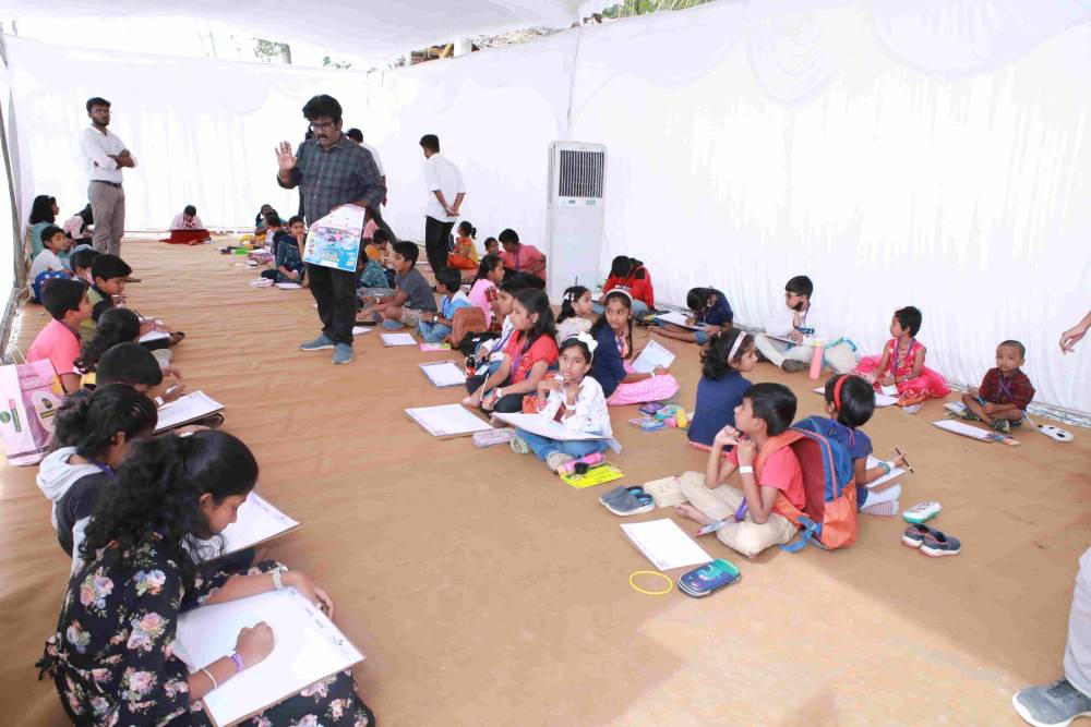 School staffs giving instruction to students regarding competition.