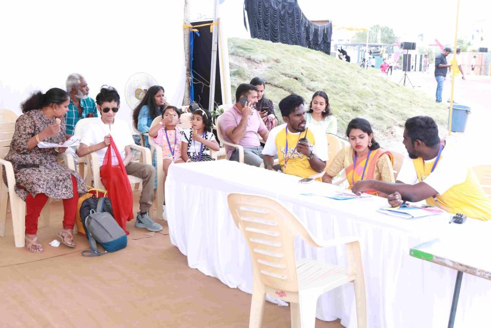 Image of students, parents and volunteers relaxing in a place.
