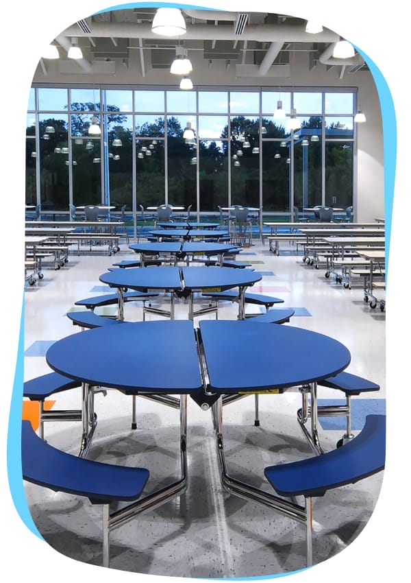 CMIS school canteen facility with blue tables, healthy meals, and hygiene practices.