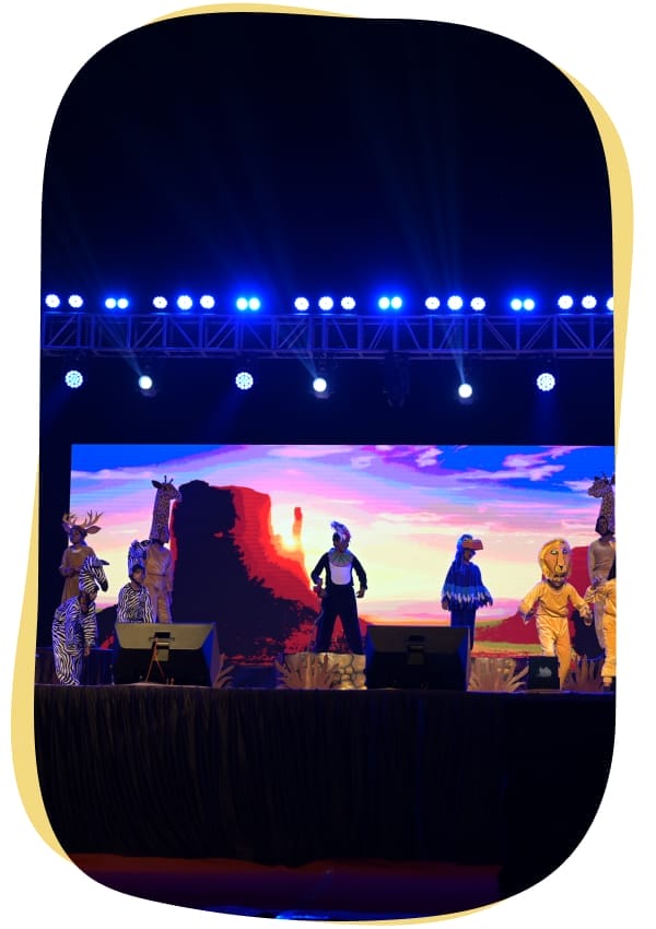 Students perform drama on stage showcasing creativity, confidence, and teamwork