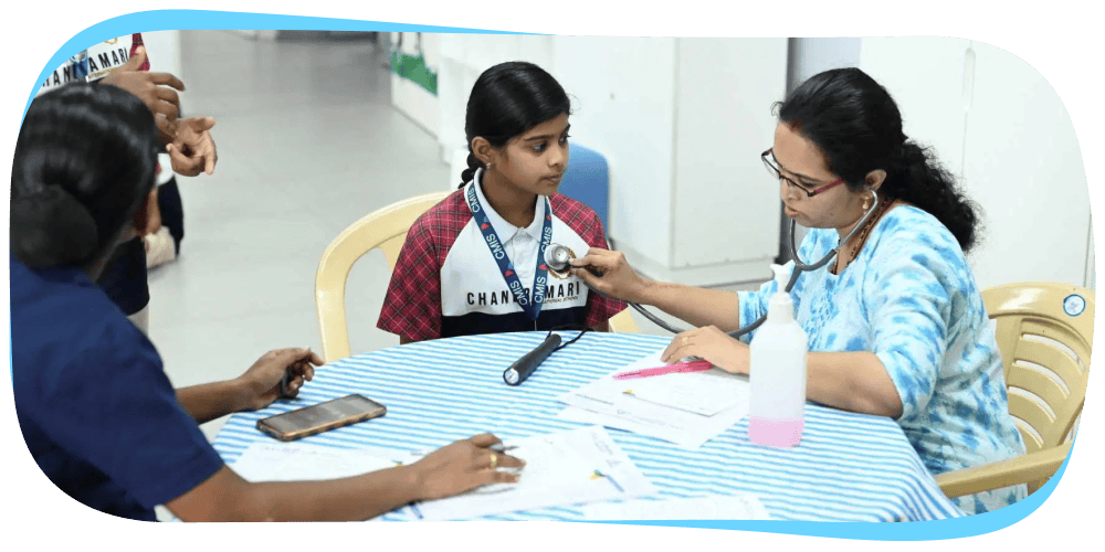 CMIS Medical Camp student receiving health check-up from a doctor.
