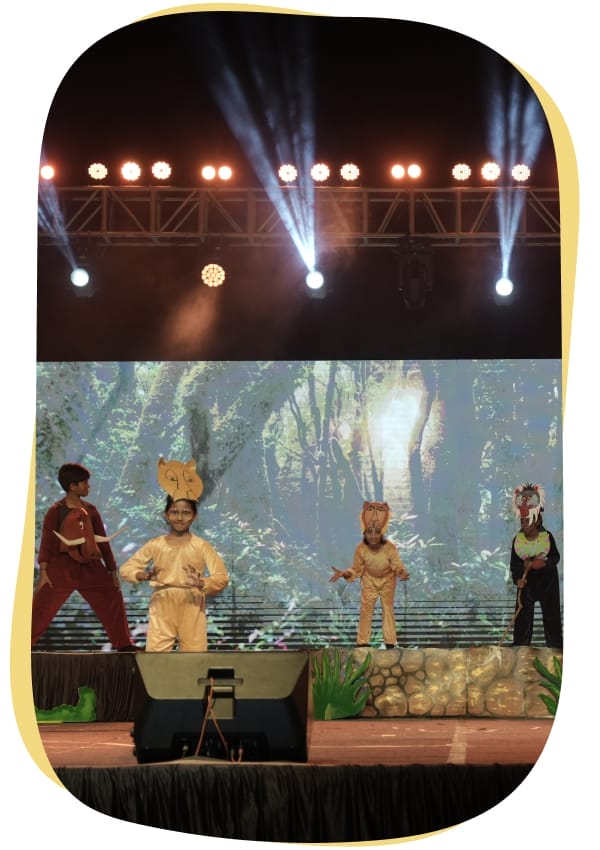 Students performing in a play at CMIS school Performing Arts event.