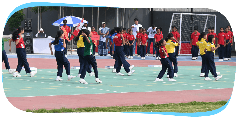 Students running races during CMIS school Sports Day.