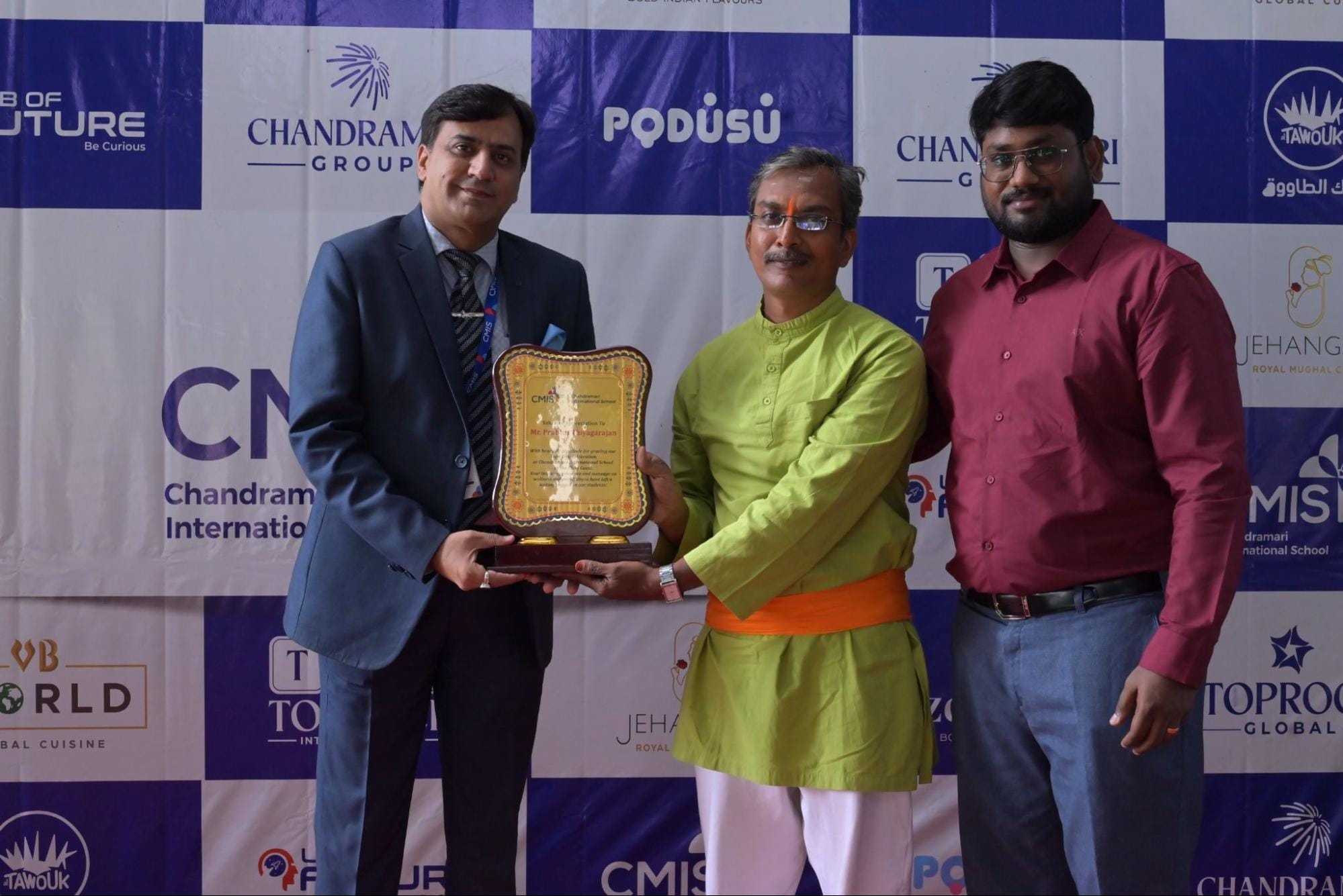 Award presentation at CMIS International Yoga Day event.