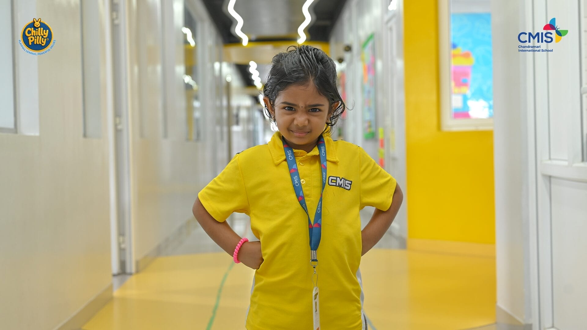 CMIS School student proudly shows strength in Activity Corner event.
