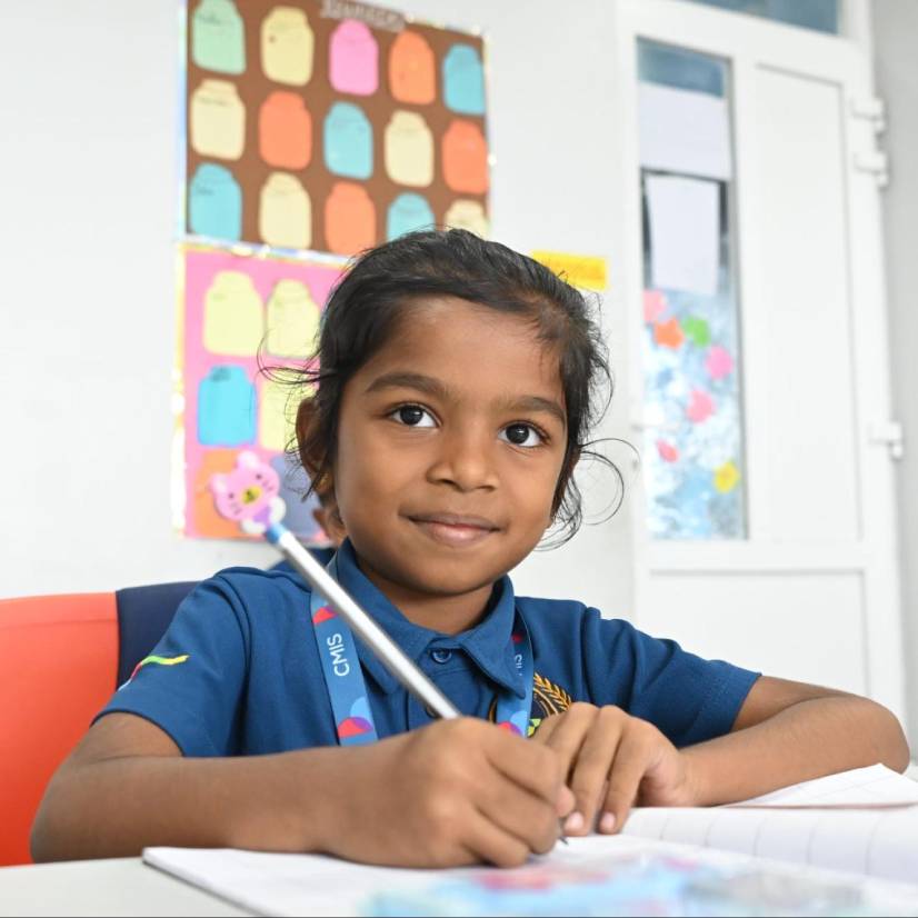 A sad child with a note after forgetting lunch, showing CMIS students’ kindness.