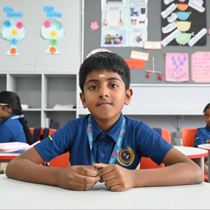 A sad child with a note after forgetting lunch, showing CMIS students’ kindness.